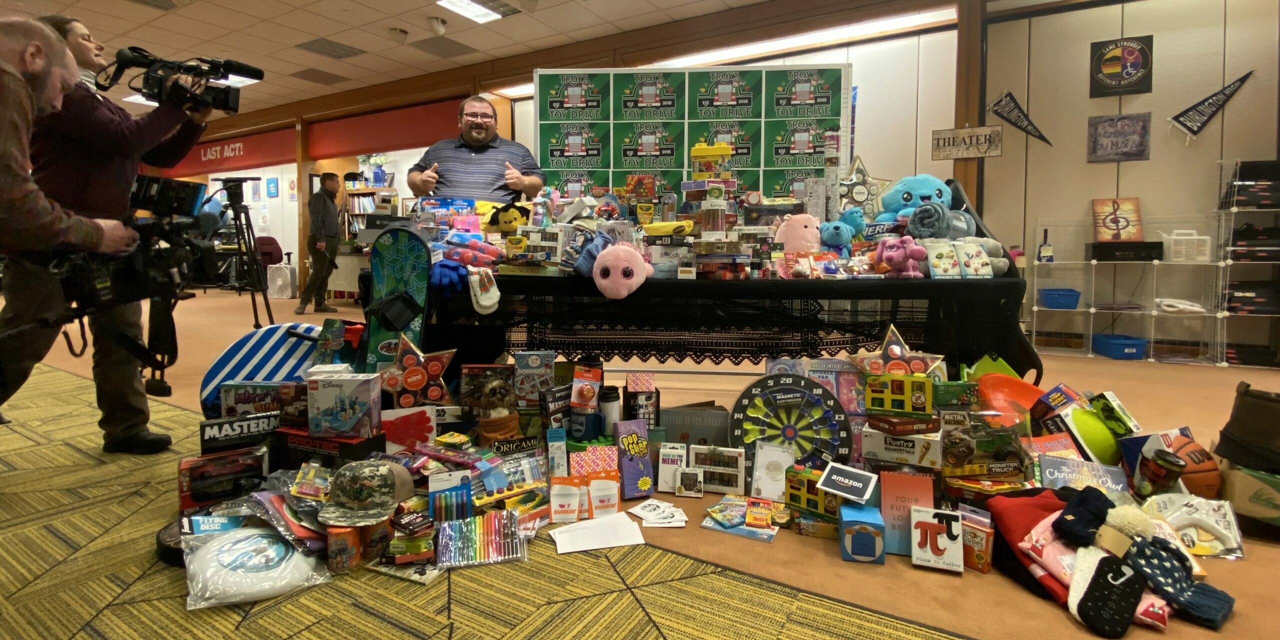 Troy Austin with toys donated by the Burlington High School community
